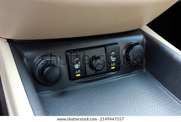 Cigarette\
lighter and seat heating switch in the\
car.