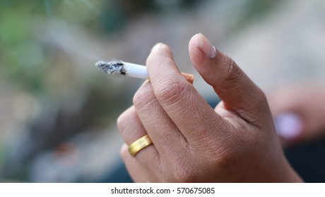 Cigarette In Smoker Hand.