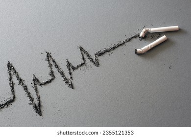 Cigarettes and cardiogram made of ash, harmful effects of cigarette smoking, creative concept 