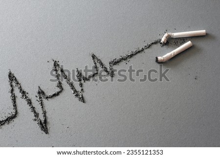 Cigarettes and cardiogram made of ash, harmful effects of cigarette smoking, creative concept 
