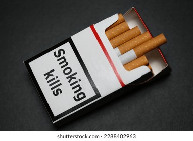 Cigarettes in cigarette box pack packet with smoking kills warning