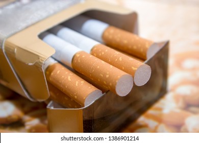 Cigarettes In A Pack. Yellow Filter. Harm To Health. Bad Habit. A Pack Of Cigarettes On The Table. Open Pack Of Cigarettes.