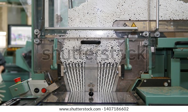 Cigarettes\
production line in a tobacco inductry\
factory