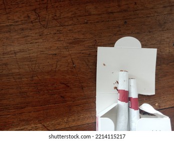 Cigarettes In A White Pack On A Wooden Table. Unhealthy Habits Illustration