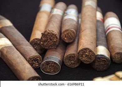 cigars on black background