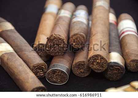 cigars on black background