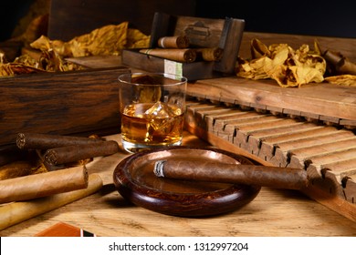 Cigars and Whiskey on wooden Background