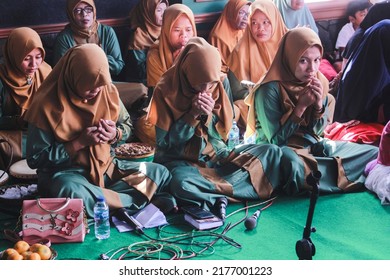 Cilacap, Indonesia 10 July 2022; A Group Of Mothers Praying At A Religious Event