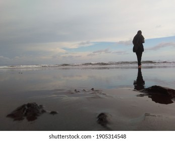 Cilacap, Indonesia - MEI 27th, 2017 - 
A Person Standing Alone By The Beach Still Realizing How Beautiful His Gift Is