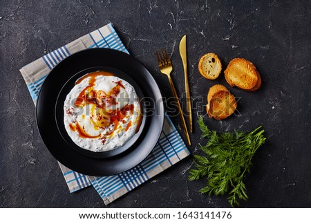 Similar – Tomatencremesuppe in roter Schüssel auf Grunge-Hintergrund