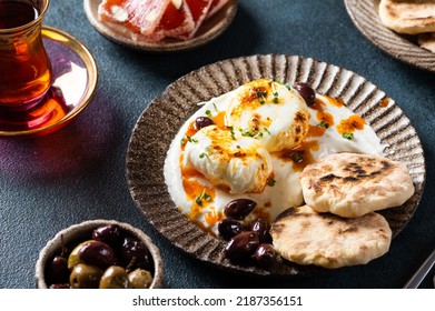 Cilbir Or Turkish Eggs. Mezze: Poached Eggs Topped Over Herbed Greek Yogurt, Then Drizzled With Hot Spiced Paprika Olive Oil. Traditional Turkish Breakfast With Rahat