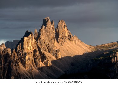 Cima Ambrizzola In UNESCO Dolomites During Golden Hour Sunset With Dark Grey Sky