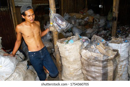 CIMAHI, JAVA, INDONESIA, FEB 22, 2005: A Young Man Collecting Plastic Bottles On A Landfill Near The City Of Cimahi.