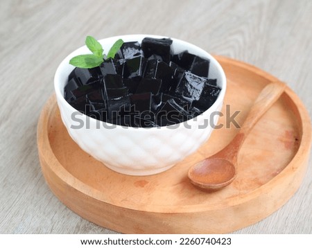 cincau hitam is black jelly made from the leaves of mesona palustris or other mesona family plant. its One of the popular ingredient desert menu when breaking the fast. selected focus 