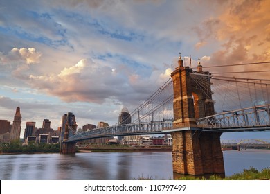 Cincinnati. Image of Cincinnati and John A. Roebling suspension bridge at sunset.