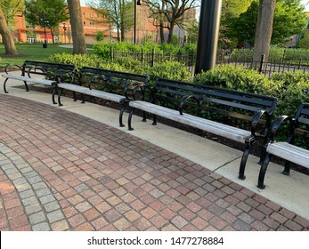 Cincinnati, OH / USA - April 22, 2019: Multiple Benches In A Row At The Washington Park In Cincinnati Ohio.