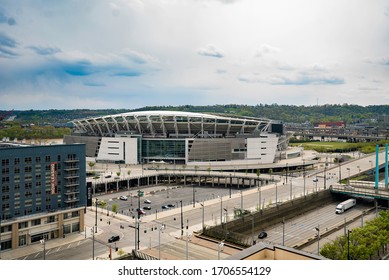 Cincinnati, Ohio / USA - April 14 2020: The Empty Paul Brown Stadium Shot From A High Rise In Downtown Cincinnati With The I-71 Highway And A Parking Lot In The Foreground On A Partly Cloudy Day.