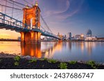 Cincinnati, Ohio, USA. Cityscape image of Cincinnati, Ohio, USA downtown skyline with reflection of the city in the Ohio River at spring sunset.