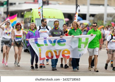 Cincinnati, Ohio, USA - June 22, 2019: The Cincinnati Pride Parade, Men And Women Carrying A Banner That Says, Live Love