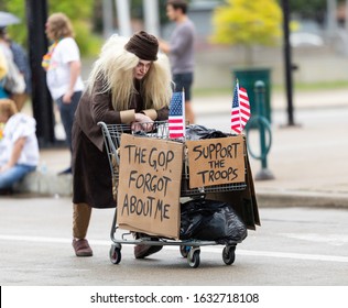 Cincinnati, Ohio, USA - June 22, 2019: The Cincinnati Pride Parade, Woman dress up as a homeless person, pretending to be a homeless Veteran, support the troops, the DOP forgot about me