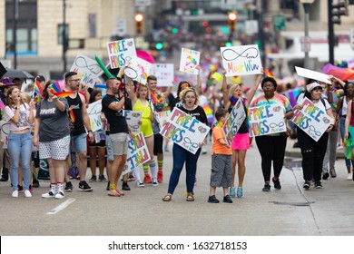 Cincinnati, Ohio, USA - June 22, 2019: The Cincinnati Pride Parade, People Holding Signs That Says 