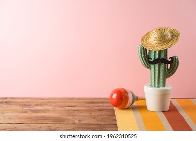 Cinco De Mayo Holiday Background With Mexican Cactus,  Party Sombrero Hat And Maracas On Wooden Table