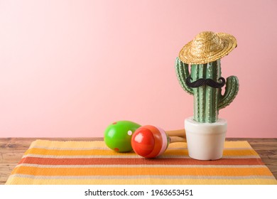 Cinco De Mayo Holiday Background With Mexican Cactus,  Party Sombrero Hat And Maracas On Wooden Table