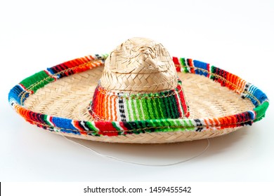 Cinco De Mayo, Traditional Mexican Hat And Caribbean Culture Concept Theme With Close Up On Wicker Or Straw Sombrero Decorated In Bright Colors Isolated On White Background