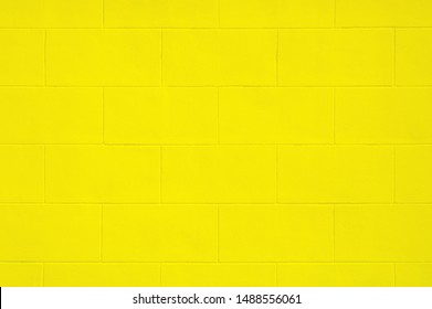Cinder block cement yellow wall painted use as background