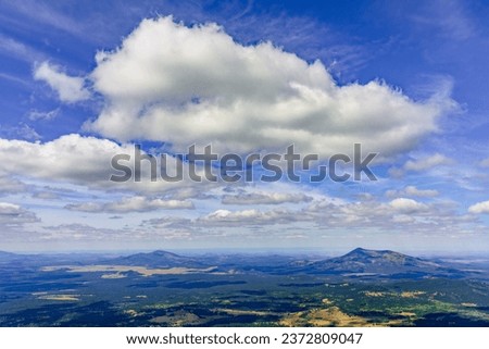 Cinder cones and high clouds to the west of Humphreys Peak near Flagstaff Arizona