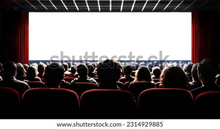 Cinema blank wide screen and people in red chairs in the cinema hall. Blurred People silhouettes watching movie performance.