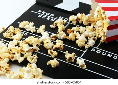 Cinema concept with popcorn and clapperboard