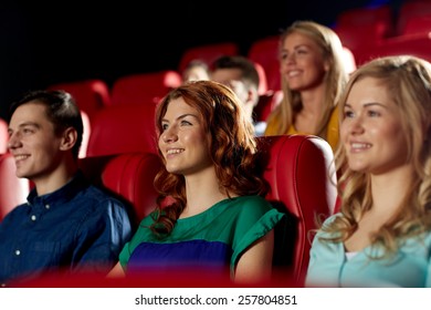 Cinema, Entertainment And People Concept - Happy Friends Watching Movie In Theater