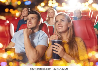 Cinema, Entertainment And People Concept - Happy Friends Watching Movie In Theater