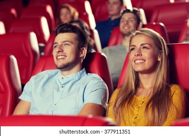 Cinema, Entertainment And People Concept - Happy Friends Watching Movie In Theater