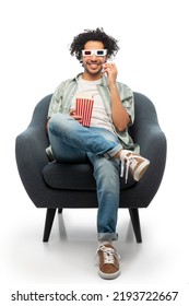 Cinema, Leisure And Entertainment Concept - Happy Smiling Young Man In 3d Glasses With Popcorn Sitting In Chair Over White Background