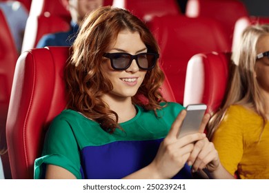 cinema, technology, entertainment and people concept - happy woman with 3d glasses and smartphone reading message in movie theater - Powered by Shutterstock