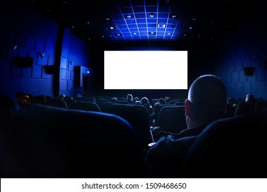 Cinema Or Theater In The Auditorium. People Watching A Movie. Mockup With White Blank Screen