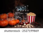 Cinema Theater Poster: Film Clapperboard, Watching Film Movie. Movie genre: thriller, love drama. Popcorn and Glasses from Cinema Theater. Halloween scene: Pumpkins, Mist, Fog, Smoke, Fire and Spiders