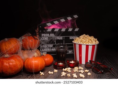 Cinema Theater Poster: Film Clapperboard, Watching Film Movie. Movie genre: horror, nightmares. Popcorn and Glasses from Cinema Theater. Halloween scene: Pumpkins, Mist, Fog, Smoke, Fire and Spiders - Powered by Shutterstock