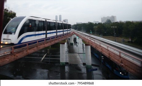 Cinemagraph - Train on elevated tracks within buildings at the Loop, Glass and Steel bridge between buildings. Train in the city