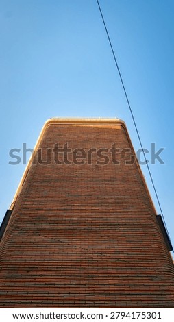 Cinematic Abstract Low Angle Perspective of Tall Brick Facade