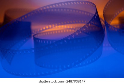 cinematic background with real film strip - Powered by Shutterstock