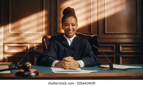 Cinematic Court of Law Trial: Portrait of Impartial Smiling Female Judge Looking at Camera. Wise, Incorruptible, Fair Justice Doing Her Job Professionally, Sentencing Criminals and Protecting Innocent