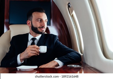 Cinematic Image Of A Businessman Flying On His Private Jet. Concept About Business, And Transportation