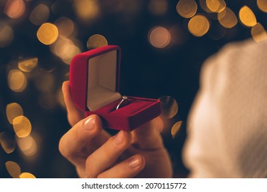 Cinematic Image Of A Couple Celebrating Christmas At Home. Boyfriend And Girlfriend Spending Time Together On The New Year Evening And Sharing Positive Vibes. 