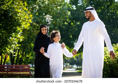 cinematic image of a family from the emirates spending time at the park - Shutterstock ID 2070104678