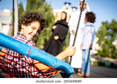Cinematic image of a family playing at the playground in Dubai