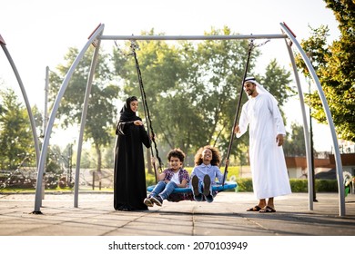 Cinematic image of a family playing at the playground in Dubai