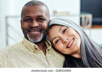 cinematic image of an happy multiethnic senior couple. Indoors Lifestyle moments at home. Concept about seniority and relationships - Shutterstock ID 2189224405